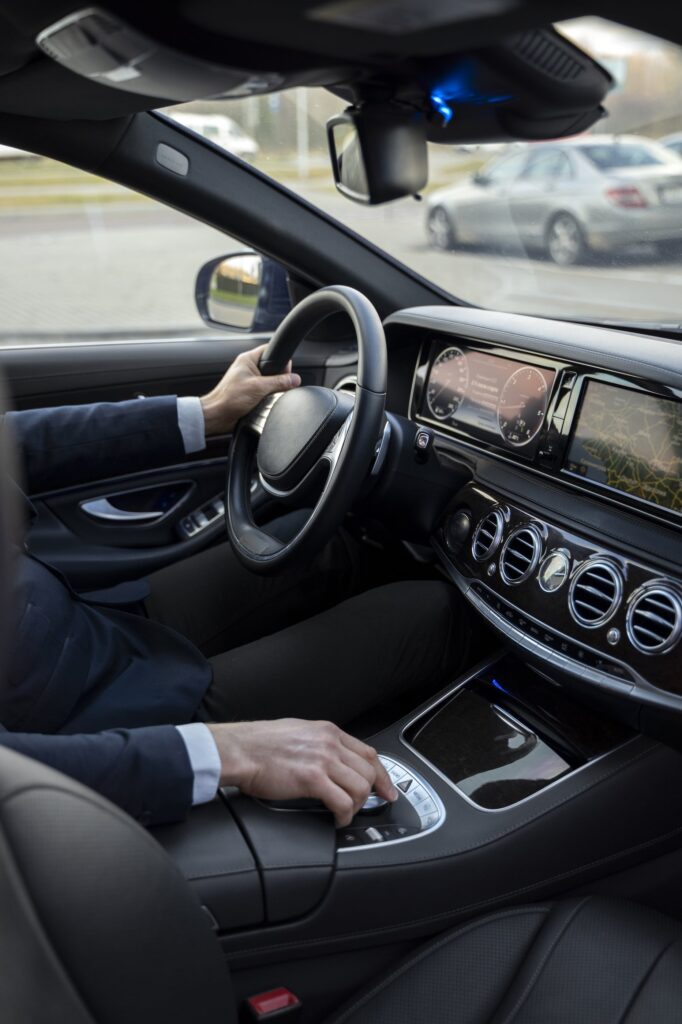 elegant uber driver giving taxi ride scaled